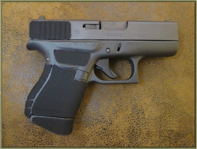 Image of Glock 43 9mm with grip enhancements.