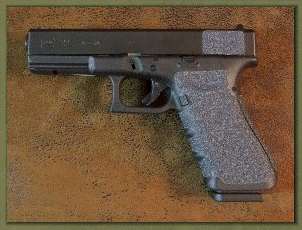 Glock 22 with sand paper pistol grips installed.