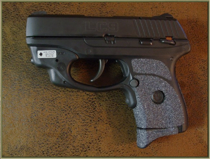 Image of Ruger LC9 With Crimson Trace Grip Activated Laser with grip enhancements.