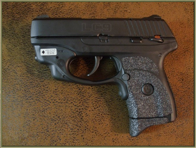 Image of Ruger LC9 With Crimson Trace Grip Activated Laser with grip enhancements.