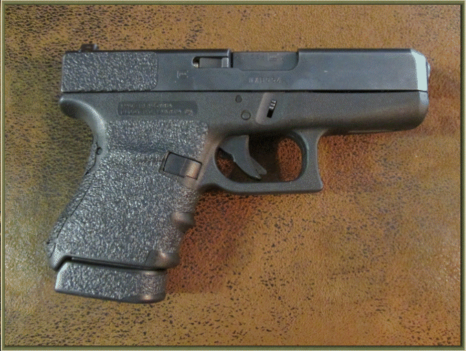 Image of Glock 36 with grip enhancements.