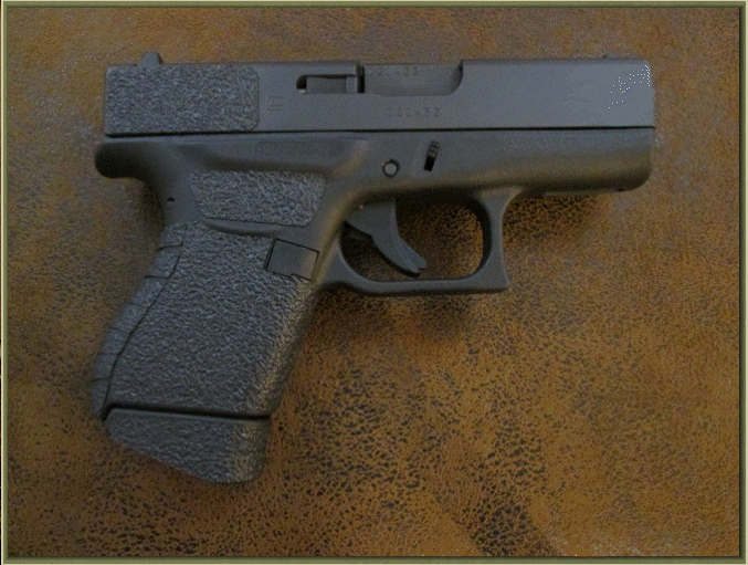 Image of Glock 43 9mm with grip enhancements.