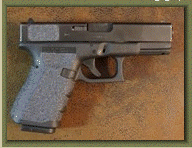 Glock 19 with sand paper pistol grip enhancements.
