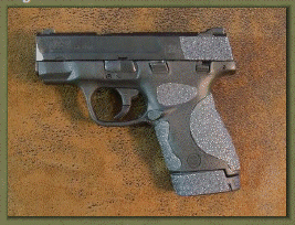 Smith & Wesson M&P SHIELD 9mm. 40 caliber with sand paper pistol grips installed.