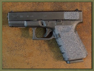 Glock 19 with sand paper pistol grips installed.