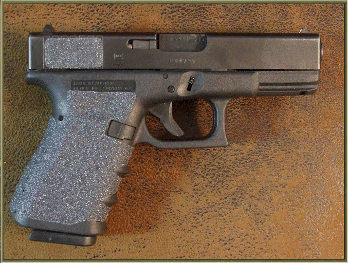 Glock 19 with sand paper pistol grips installed.
