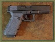 Glock 21 with sand paper pistol grip enhancements.