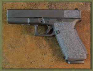 Glock 22 with sand paper pistol grips installed.