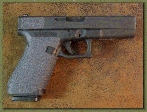 Glock 21 Gen 1 with sand paper pistol grips installed.