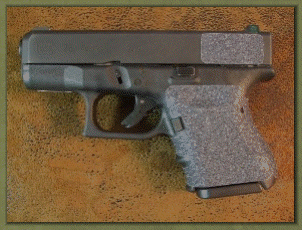 Glock 26 with sand paper pistol grips installed.