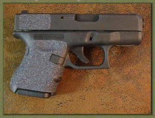Glock 26 with sand paper pistol grips installed.