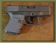 Glock 26 with sand paper pistol grip enhancements.