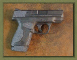 Smith & Wesson M&P Shield 9mm with sand paper pistol grip enhancements.