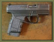 Walther PPS with sand paper pistol grip enhancements.