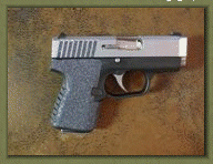 Kahr PM9, PM40, CM9, CM40 with sand paper pistol grip enhancements.