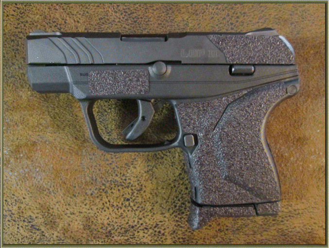 Image of Ruger LCP II .380 ACP with grip enhancements.