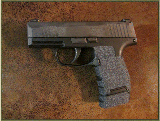 Image of Sig Sauer P365 with grip enhancements.