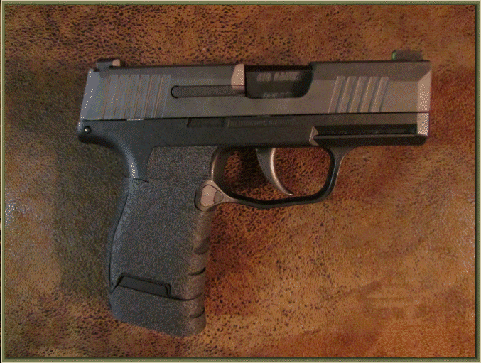 Image of Sig Sauer P365 with grip enhancements.
