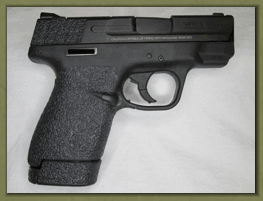 Smith & Wesson M&P SHIELD M2.0 9mm. 40 caliber with sand paper pistol grips installed.