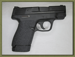 Smith & Wesson M&P SHIELD M2.0 9mm. 40 caliber with sand paper pistol grips installed.